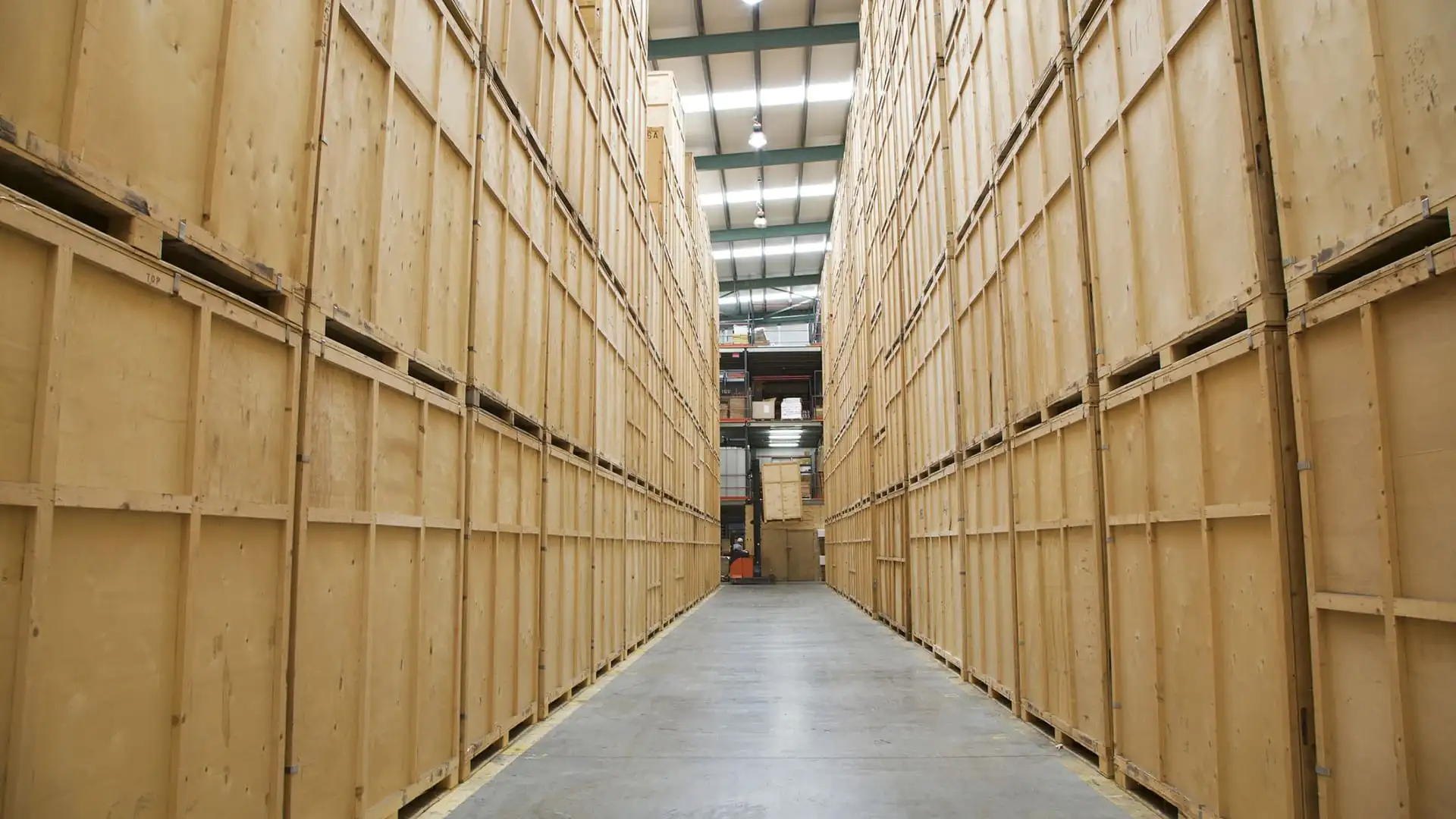 Organised home interior with labelled storage boxes stacked neatly