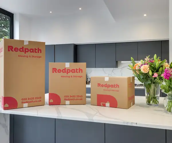 Redpath packing specialist carefully wrapping household items